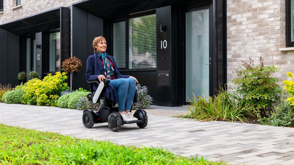 A person using a TGA Whill C2 mobility scooter
