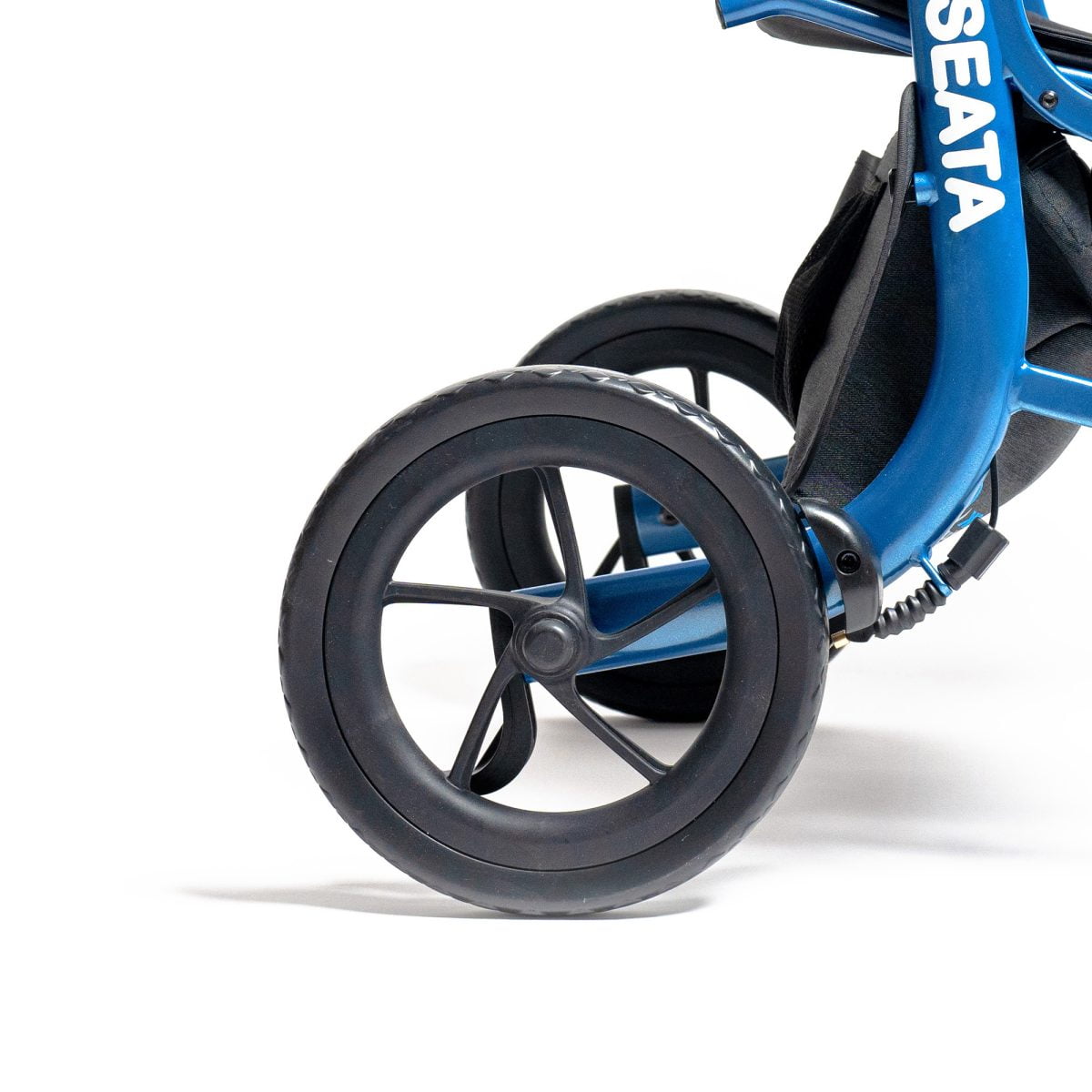 The rear wheels of a Seata rollator