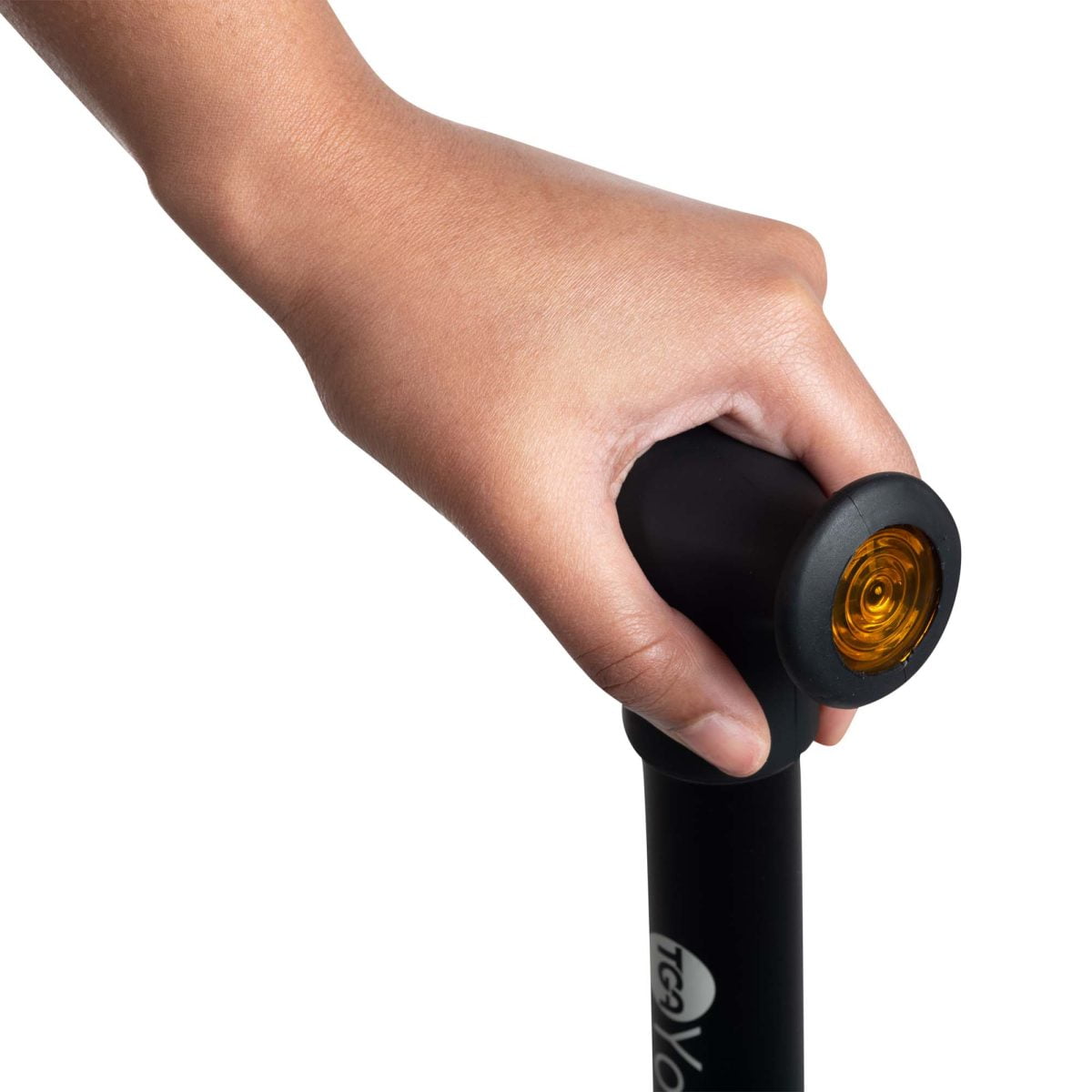 A hand holding a walking stick